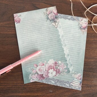 sage green stationery with taupe lace borders and pink and white floral bouquets